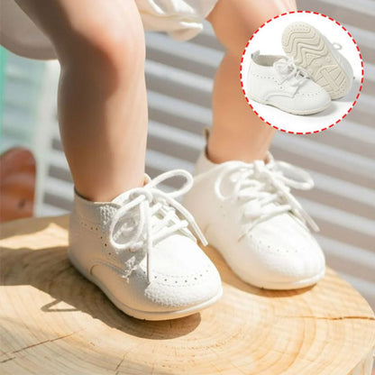 Chaussures bébé blanches avec lacets cuir souple premiers pas